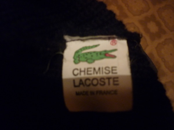 Как отличить lacoste. Лакост made in France оригинал. Трусы Lacoste бирка. Оригинальная бирка Lacoste.