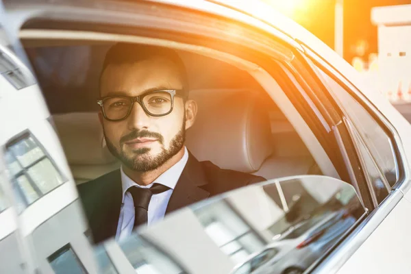 Handsome Businessman Sitting Car Looking Camera Sunset — стоковое фото