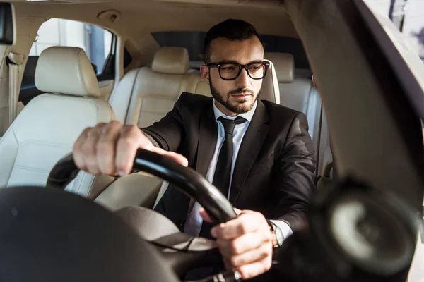 Handsome Driver Suit Driving Car Looking Side Mirror — стоковое фото