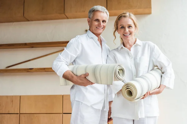 Happy Senior Couple Holding Yoga Mats Smiling Camera — стоковое фото