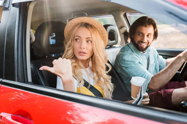 Girlfriend Holding Map Showing Way Boyfriend While Traveling Car — стоковое фото